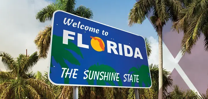 Welcome to Florida, The Sunshine State sign with palm trees 